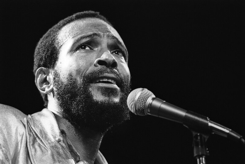 Man Singing into Microphone — Black, Dramatic, Night, Photograph, Beard