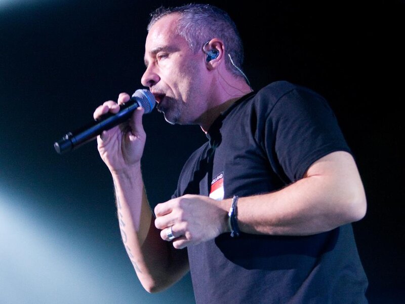 Man Singing into Microphone — Black, Dramatic, Night, Photograph, Earpiece