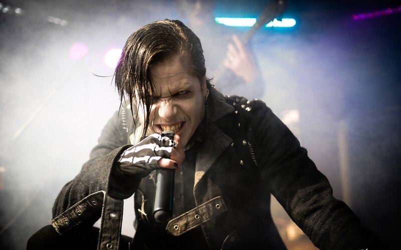 Man Singing into Microphone — Black, Dramatic, Night, Photograph, Gloves