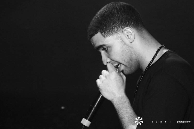 Man Singing into Microphone — Black, Dramatic, Night, Photograph, Necklace