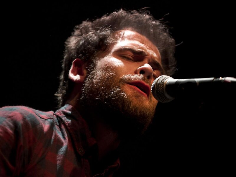 Man Singing into Microphone — Black, Dramatic, Night, Photograph, Plaid Shirt
