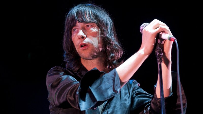 Man Singing into Microphone — Black, Dramatic, Night, Photograph, Stage Light, Black Shirt