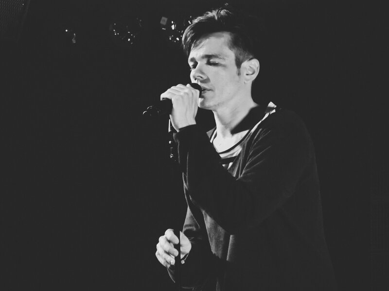 Man Singing into Microphone — Black, Dramatic, Night, Photograph, Stage Lighting