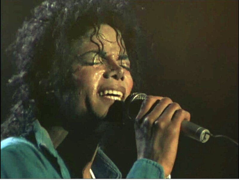 Man Singing into Microphone — Black, Dramatic, Photograph, Curly Hair