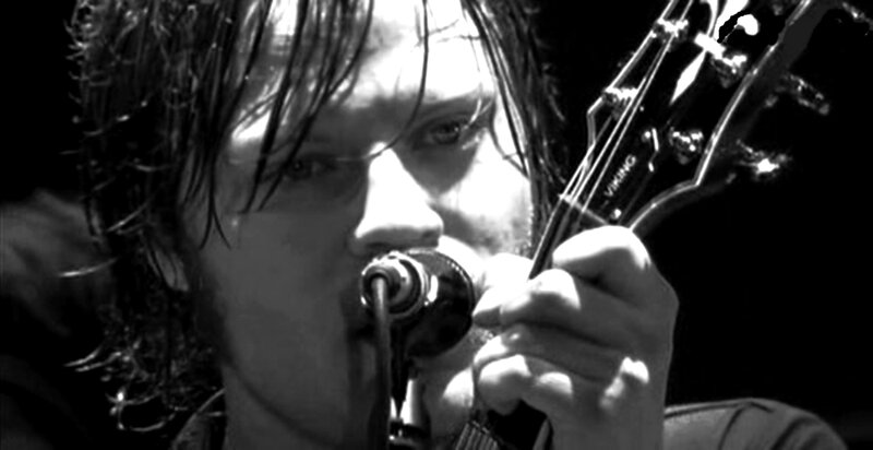 Man Singing into Microphone — Black, Dramatic, Photograph, Guitar