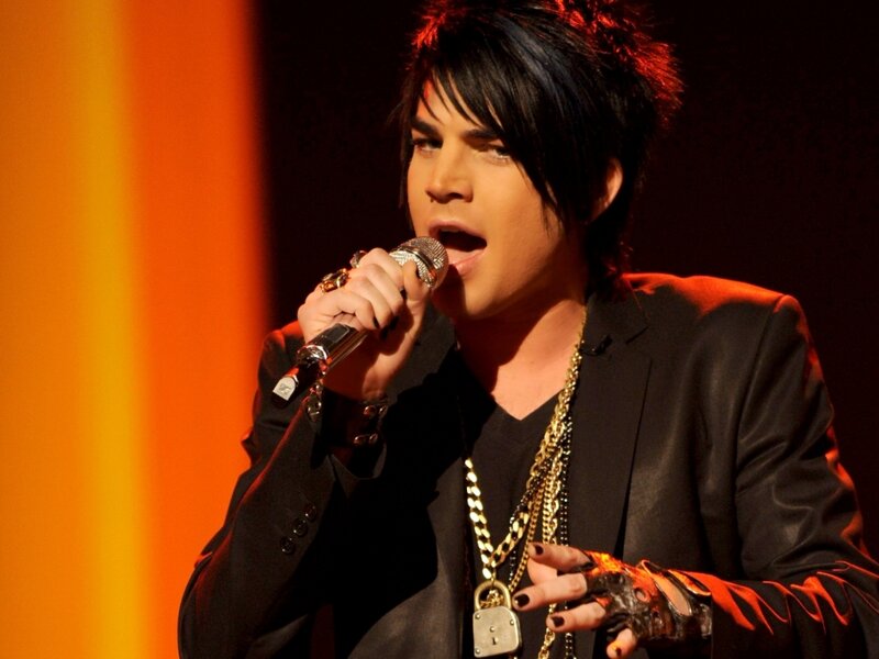 Man Singing into Microphone — Black, Dramatic, Photograph, Jacket, Necklace