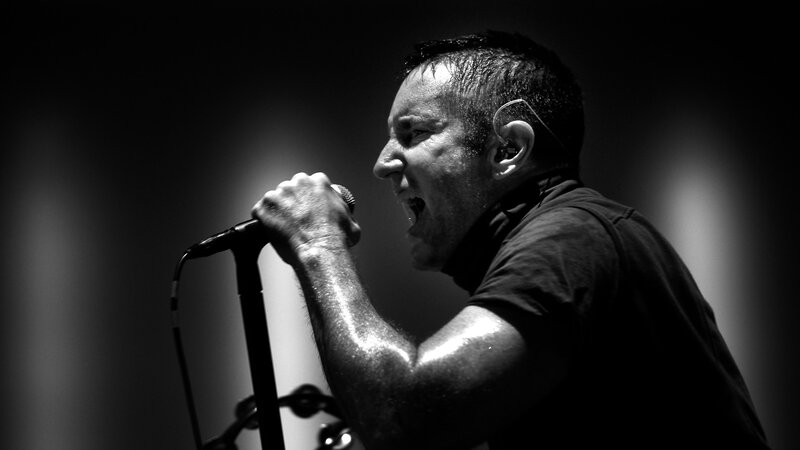 Man Singing into Microphone — Black, Dramatic, Photograph, Stage Light, Earpiece