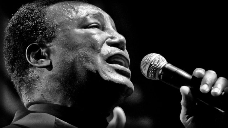 Man Singing into Microphone — Black, Dramatic, Photograph, Sweat