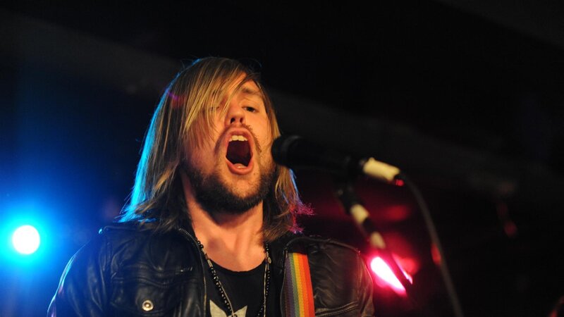 Man Singing into Microphone — Black, Energetic, Night