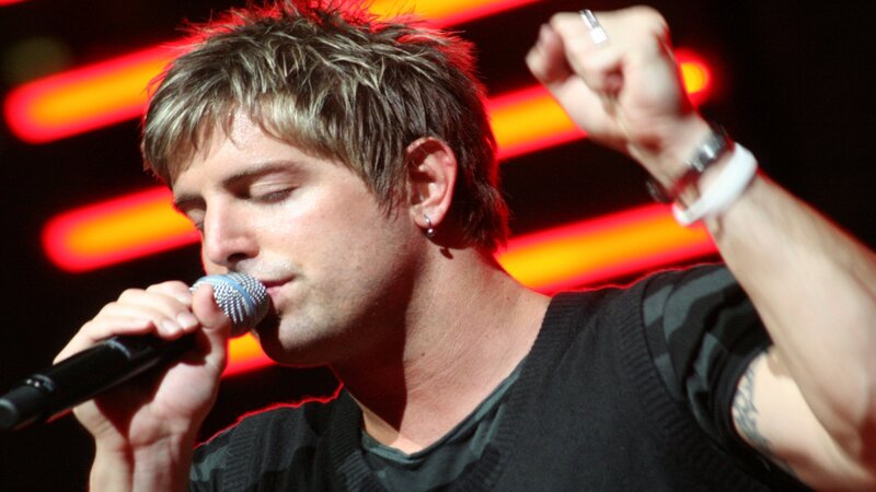 Man Singing into Microphone — Black, Energetic, Photograph, Ring