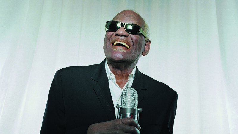 Man Singing into Microphone — Black, Energetic, Photograph, Sunglasses, Suit