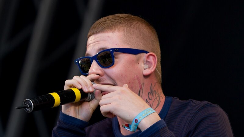 Man Singing into Microphone — Black, Energetic, Photograph, Sunglasses
