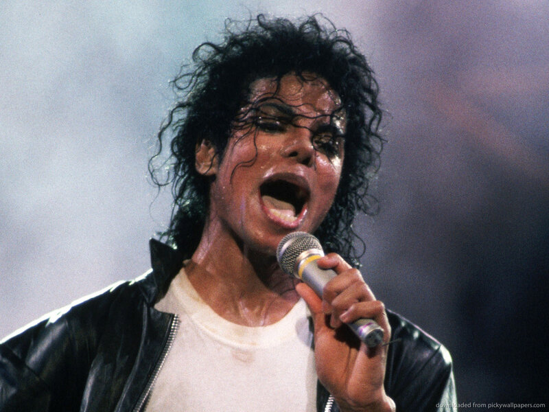 Man Singing into Microphone — Black, Intense, Photograph, Leather Jacket