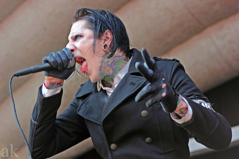 Man Singing into Microphone — Black, Intense, Photograph, Tattoos