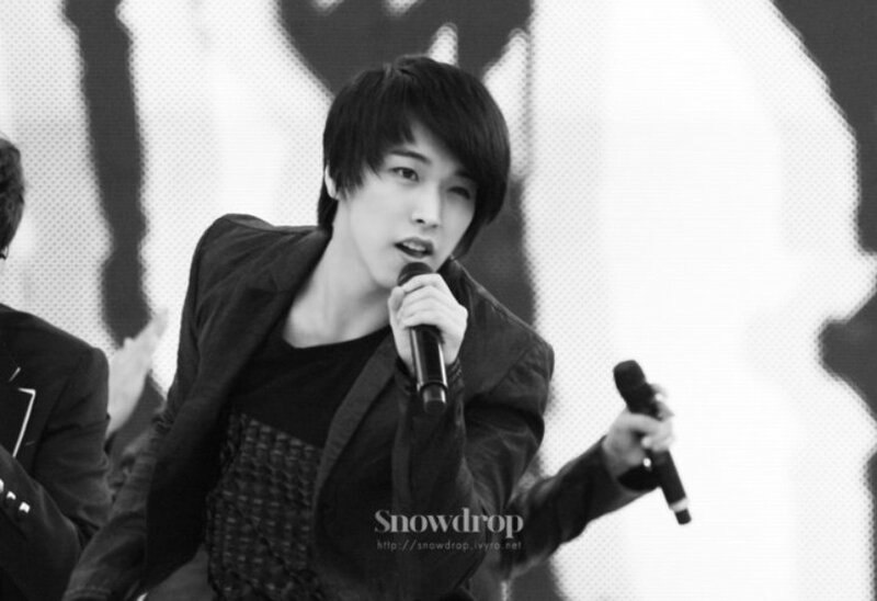 Man Singing into Microphone — Black, Performative, Photograph