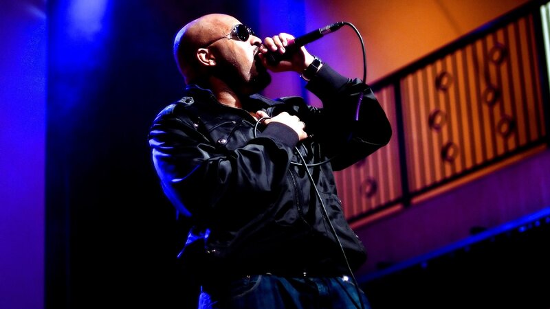 Man Singing into Microphone — Blue, Dramatic, Night, Photograph, Sunglasses