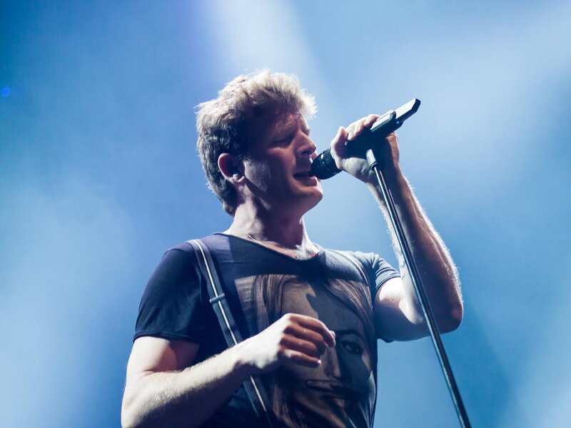 Man Singing into Microphone — Blue, Dramatic, Photograph, Stage Light