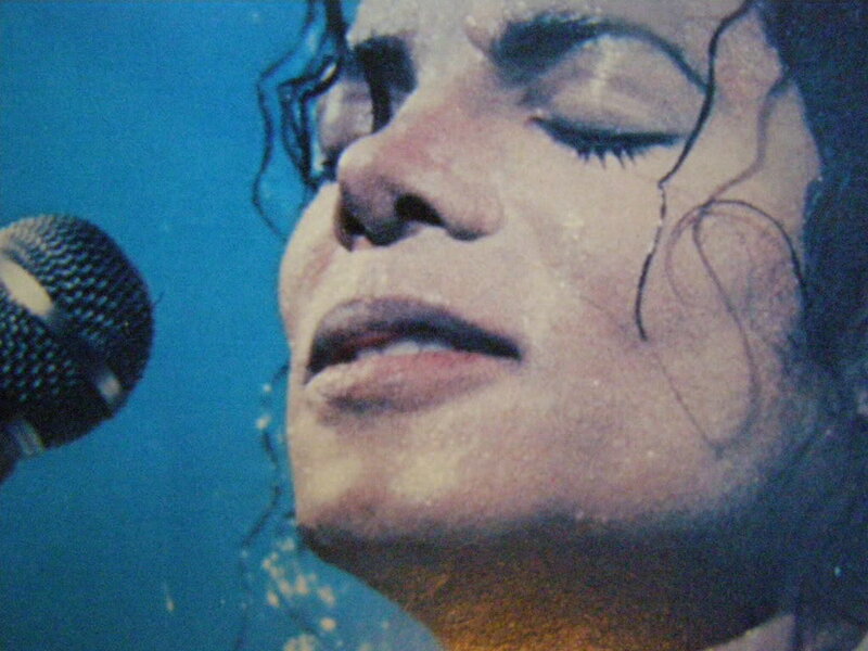 Man Singing into Microphone — Blue, Dramatic, Photograph