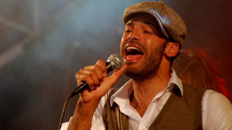 Man Singing into Microphone — Brown, Dramatic, Photograph