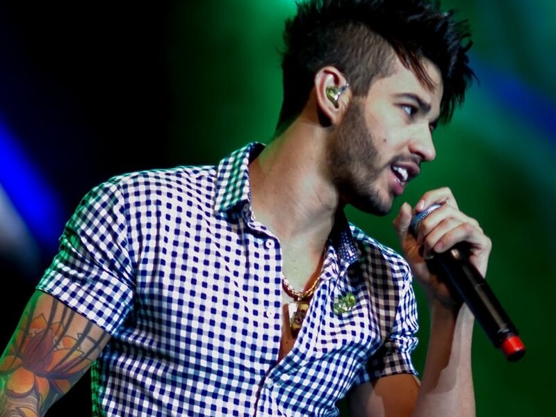 Man Singing into Microphone — Green, Energetic, Photograph