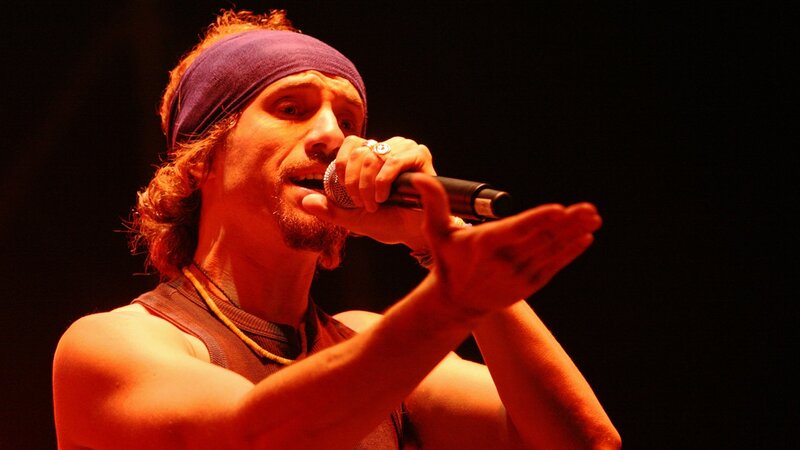 Man Singing into Microphone — Red, Dramatic, Night