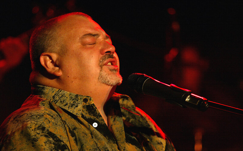 Man Singing into Microphone — Red, Dramatic