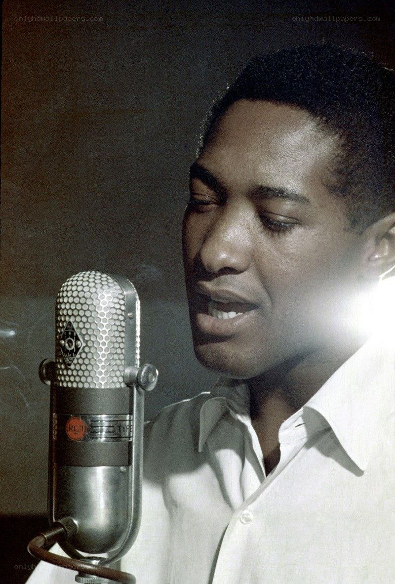 man singing into vintage microphone