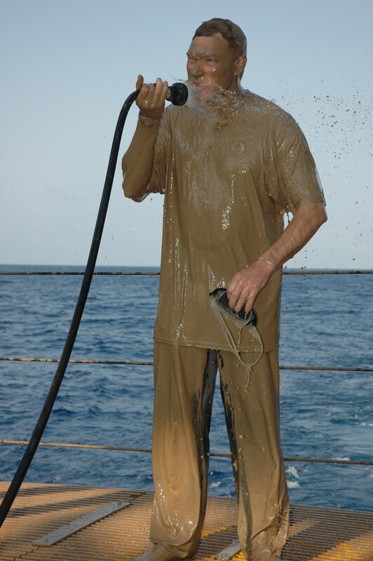 Man singing on a ship deck