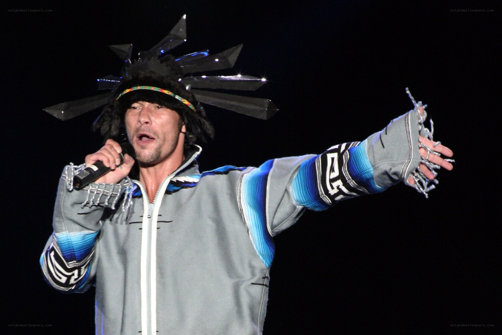 man singing on stage