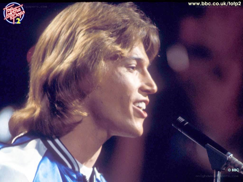 man singing on stage
