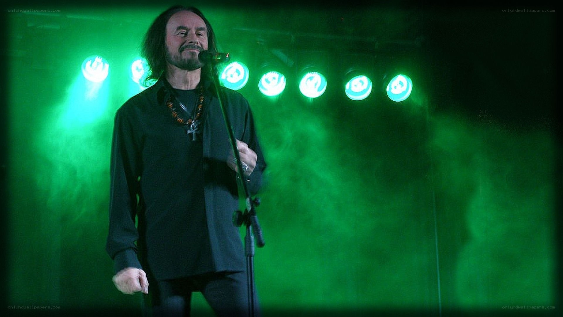 man singing on stage