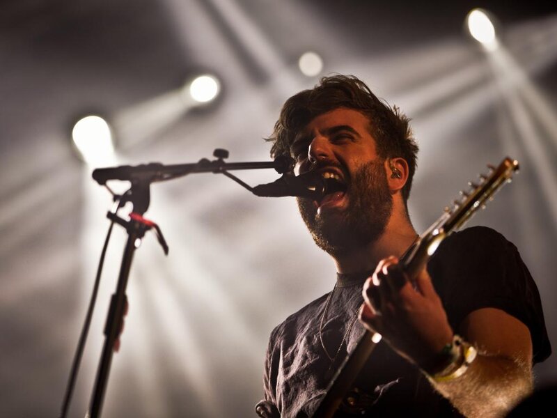 Man Singing on Stage — Black, Dramatic, Night, Photograph, Microphone, Guitar