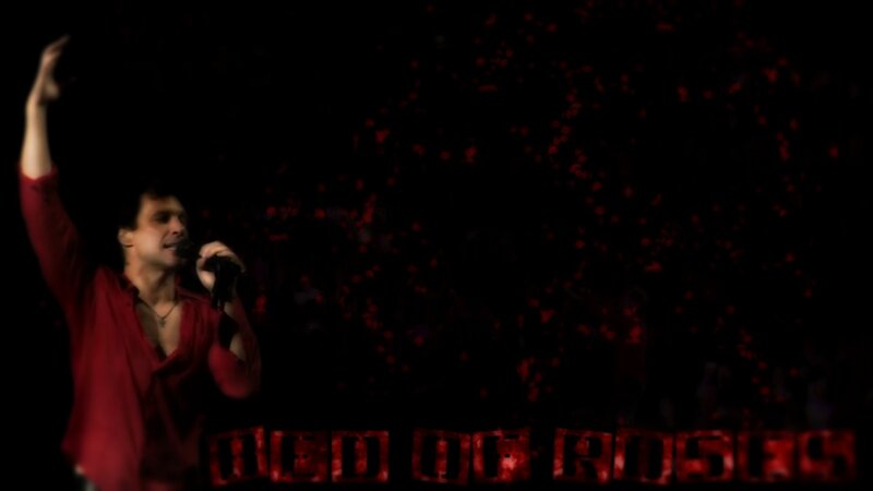 Man Singing on Stage — Black, Dramatic, Night, Photograph, Microphone, Red Shirt