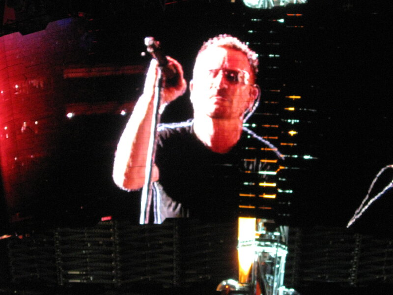 Man Singing on Stage — Black, Dramatic, Night, Photograph, Microphone, Sunglasses, Stage Lights