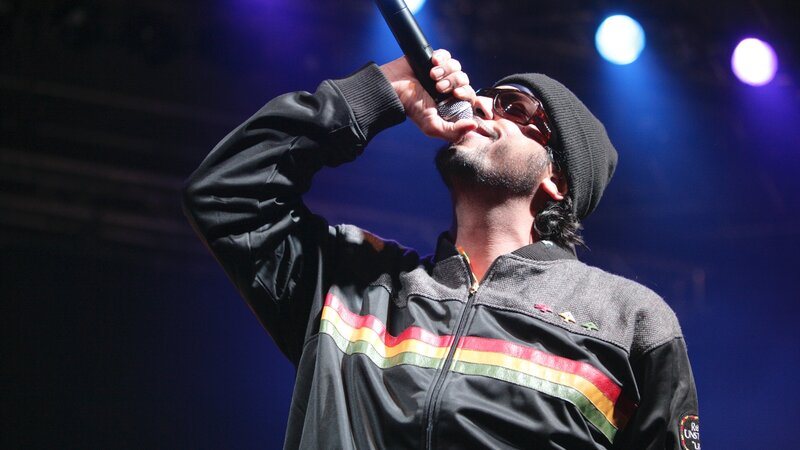 Man Singing on Stage — Black, Dramatic, Night, Photograph, Microphone, Sunglasses