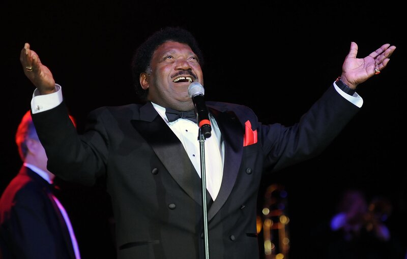 Man Singing on Stage — Black, Dramatic, Night, Photograph, Microphone, Tuxedo