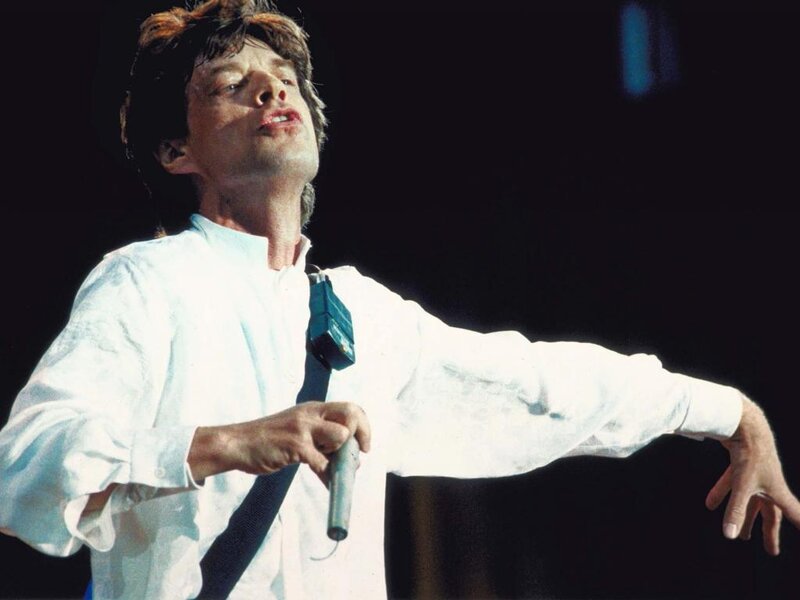 Man Singing on Stage — Black, Dramatic, Photograph, Microphone, White Shirt