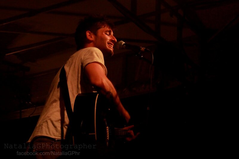 Man Singing on Stage — Black, Dramatic