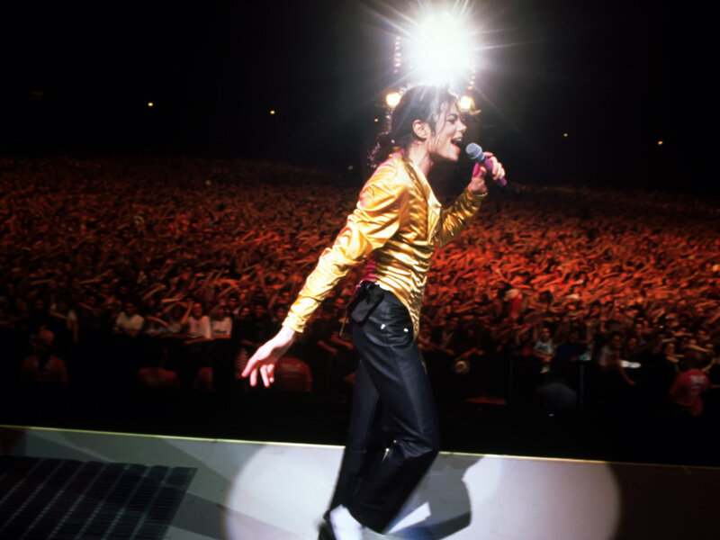 Man Singing on Stage — Black, Energetic, Night, Photograph, Crowd, Microphone, Spotlight