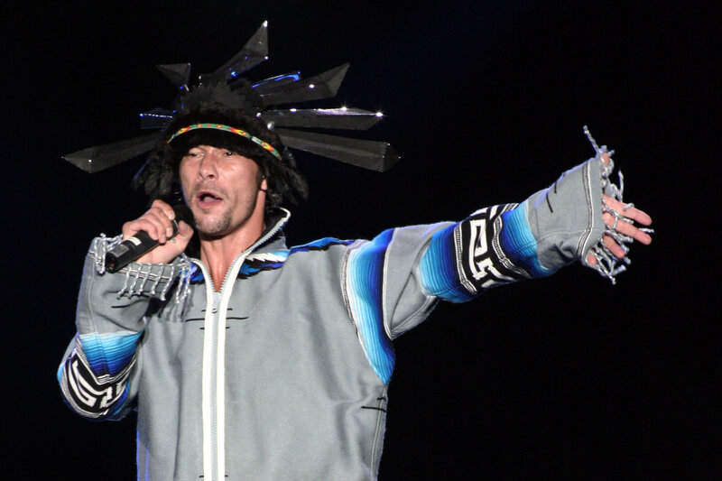 Man Singing on Stage — Black, Energetic, Night, Photograph, Microphone, Hat