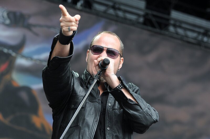 Man Singing on Stage — Black, Energetic, Photograph