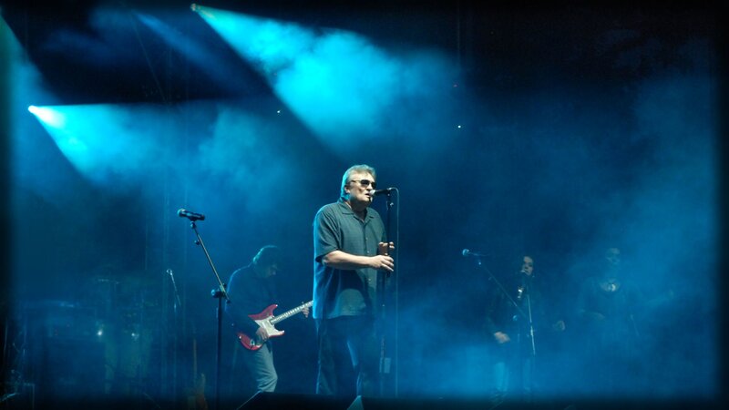 Man Singing on Stage — Blue, Dramatic, Night, Photograph, Guitarist