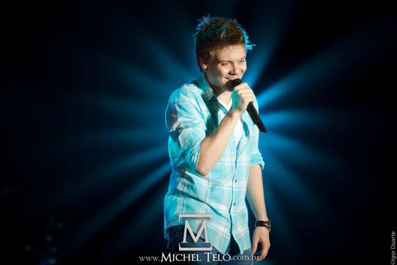 Man Singing on Stage — Blue, Dramatic, Night, Photograph, Microphone, Stage Lights