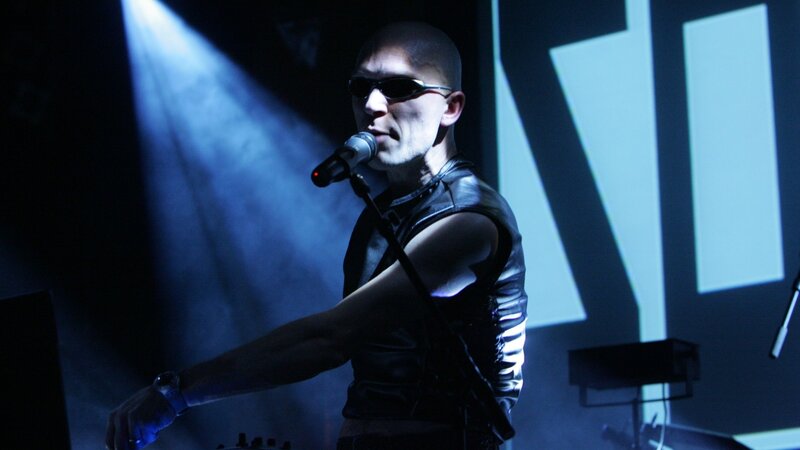 Man Singing on Stage — Blue, Dramatic, Night, Photograph, Microphone, Sunglasses