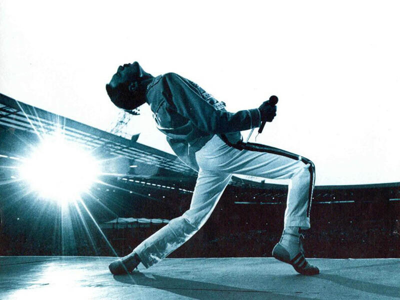 Man Singing on Stage — Blue, Dramatic, Photograph, Microphone, Stadium