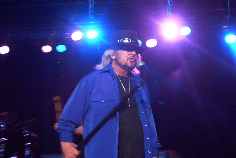 Man Singing on Stage — Blue, Dramatic