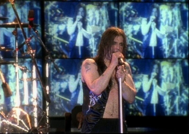 Man Singing on Stage — Blue, Energetic, Photograph