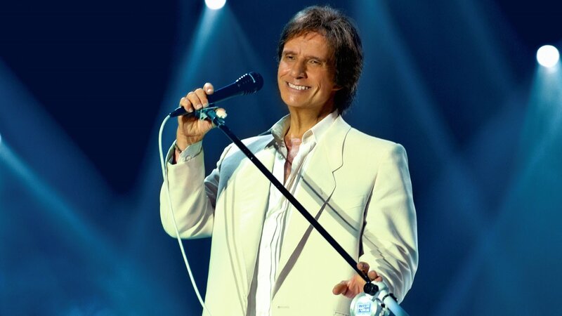 Man Singing on Stage — Blue, Lively