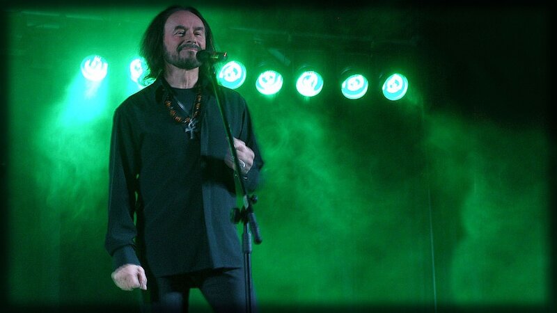 Man Singing on Stage — Green, Dramatic, Night