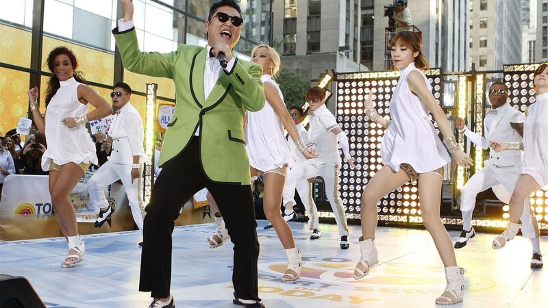 Man Singing on Stage — Green, Energetic, Afternoon, Photograph, Dancers
